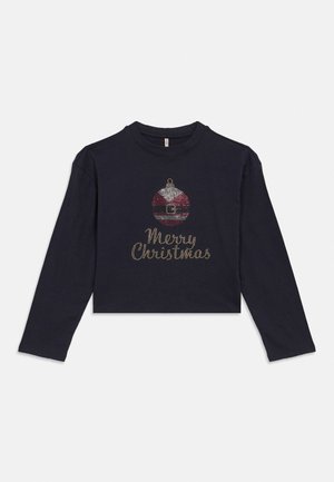 Svart langermet skjorte med rhinsten-design av en rød og hvit julepynt og ordene «God Jul» under.