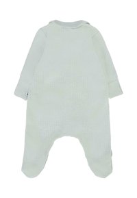 Tutina di cotone verde chiaro con texture a costine, maniche lunghe e colletto morbido. Presenta un design con i piedi e un'etichetta sul lato.