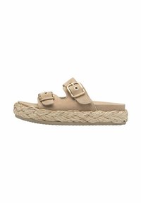 Beige slide sandal with two adjustable buckles, suede upper, and woven jute outsole. Flat sole with a textured surface for grip.