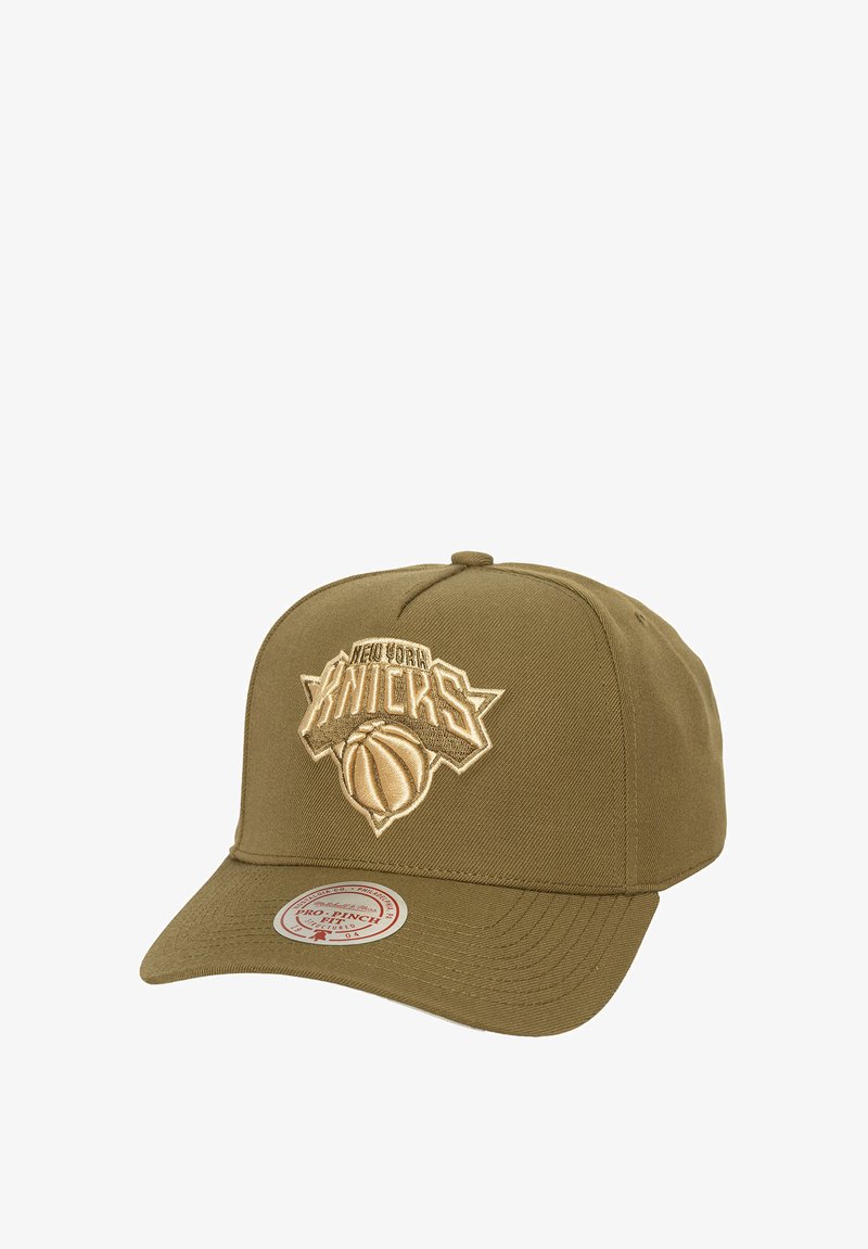 Olive green baseball cap featuring an embroidered New York Knicks logo in beige. Structured design with a flat brim and adjustable strap.