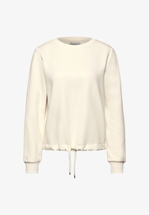 Biała bluza z okrągłym dekoltem, długimi rękawami i marszczonym dołem. Posiada sznurek w talii oraz ściągacze na rękawach. Gładka struktura materiału.