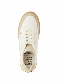 White sneaker with a smooth leather upper, beige suede accents, cream laces, and a gum rubber sole. Features ventilation holes on the sides.