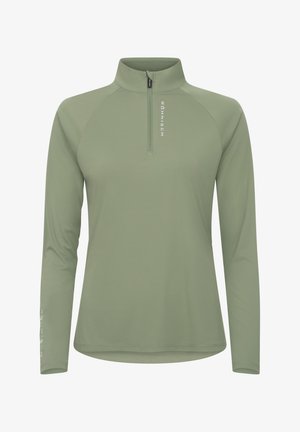 Lys grøn halv-zip top lavet af glat, strækbart stof. Har lange ærmer og brandlogoet trykt lodret på venstre ærme.