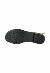Suela de zapato de goma negra con patrones geométricos texturizados. Presenta un tacón bajo y una superficie suave. Talla marcada como 37.