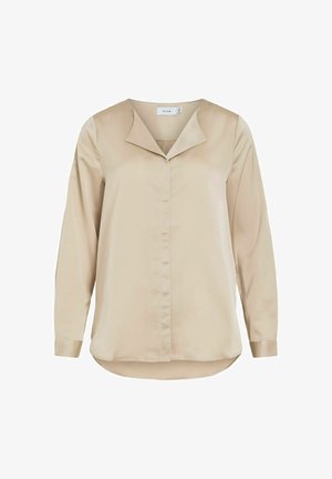 Beige langærmet bluse med en glat, satinagtig finish. Har en spids krave og knaplukning foran. Rundet kant, afslappet pasform, strukturerede ærmer.