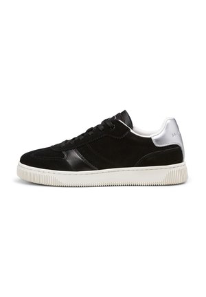 Black sneakers with a mix of suede and leather, featuring a white rubber sole, silver accents, and black laces. Simple, low-top design.