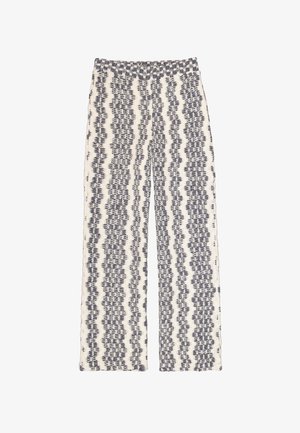 Pantalon à jambes larges en tissu texturé crème avec un motif en zigzag bleu marine. Doté d'une ceinture élastique pour un port facile.