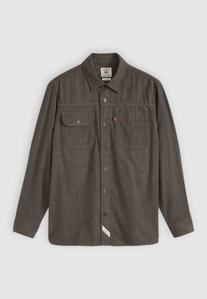 Gray long-sleeve shirt with button closure, two front pockets, and a label on the bottom left. Made from textured fabric.