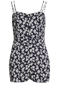 Robe à fleurs en bleu marine avec un motif de fleurs blanches, bretelles fines réglables, taille cintrée et short à coupe décontractée.