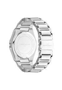 Orologio in acciaio inox argentato con cassa ottagonale, bracciale a maglia e finitura lucida. Presenta un retro liscio con dettagli del marchio.