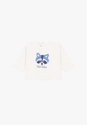 Weißes Baby-Langarmshirt mit einem blauen Waschbär-Gesicht und dem Text "Petit Bateau" unter dem Bild.