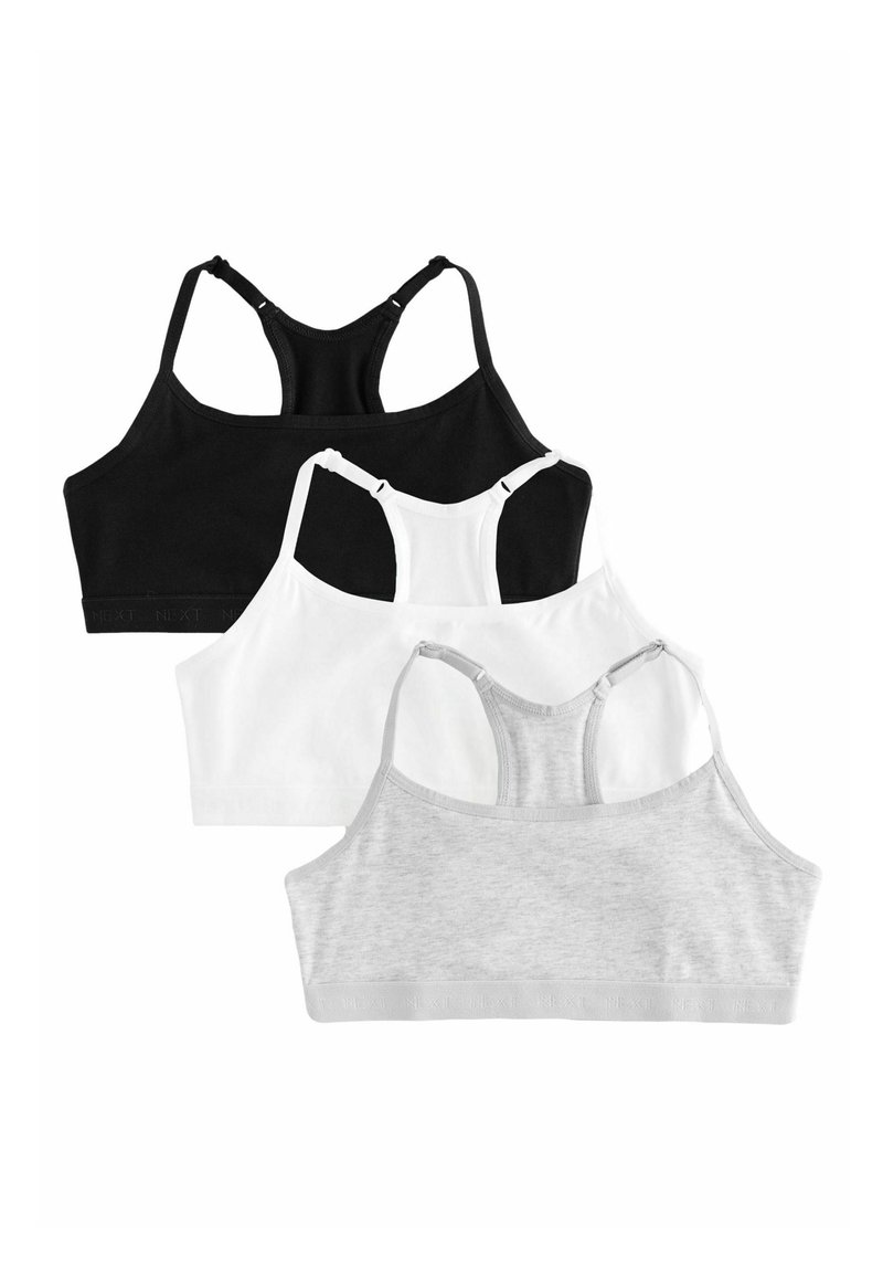 Drei Bralettes in Schwarz, Weiß und Grau. Jedes hat ein Racerback-Design, weichen Stoff und passende elastische Bänder mit einem Logo.