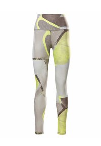 Hög midja fullängds leggings med abstrakta geometriska mönster i dämpade grå, gula och bruna nyanser.