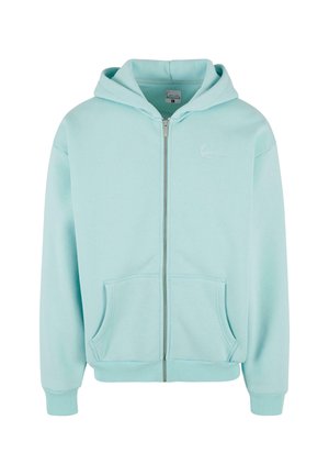 Lichtblauwe zip-up hoodie van zachte stof, met een voorzak, geribbelde manchetten en een klein geborduurd logo op de borst.