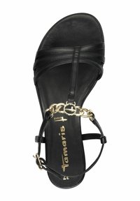 Black sandal featuring a sleek design with multiple straps, a textured sole, and a gold chain accent across the forefoot.