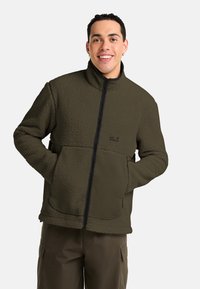 Fleece jacket in olive green with a zip front, high collar, and two front pockets. Textured fabric with a soft, plush finish.