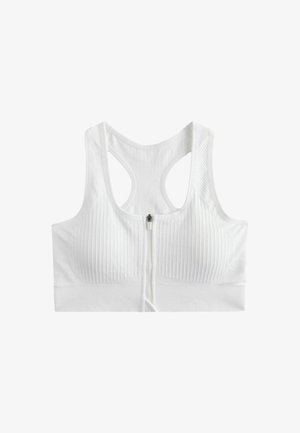 Hvid ribbet sports-bh med frontlynlås og racerback-design, lavet af strækstof for støtte og komfort.