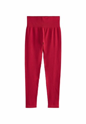 Leggings rossi a coste con cintura elastica, realizzati in un tessuto elasticizzato. Il design è aderente e sagomato alla caviglia.