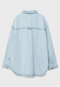 Light blue denim shirt with a loose fit, collar, long sleeves, and buttoned cuffs. Features a rounded hem and a back yoke detail.