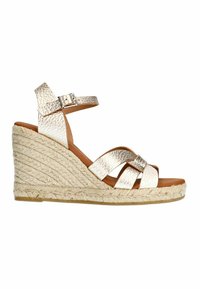 Wedge sandals with a textured metallic gold upper, an adjustable ankle strap, and a braided jute sole. Open-toe design.