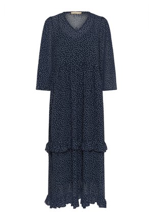 Laivastonsininen, pilkullinen midi-mekko, jossa on V-aukko, kolmivartiset hihat ja kerroksellinen röyhelöhelma. Valmistettu kevyestä, läpikuultavasta materiaalista.