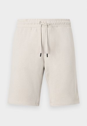 Short beige longueur genoux avec taille élastique et cordon ajustable, design uni, vue de face sur fond blanc.