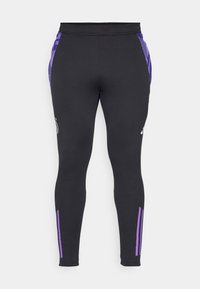 Leggings atletici neri con dettagli laterali viola, design aderente, vita elasticizzata e dettaglio logo sul davanti.