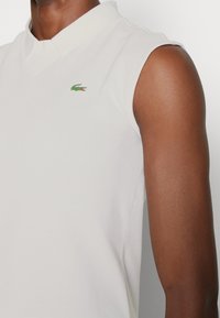 Lacoste Sport SLEEVELESS GOLF - Polotričko - blanc