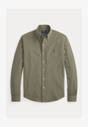 Chemise verte olive à manches longues avec boutons, col boutonné et petit logo brodé sur la poitrine.