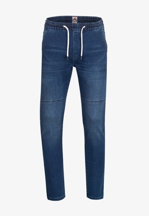 Denim joggerbukser med elastisk talje, snor og tapered fit. Har en mørkeblå farve og subtile syninger.