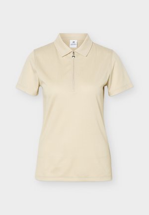 Polo beige a maniche corte in tessuto strutturato, con colletto e chiusura frontale con zip.