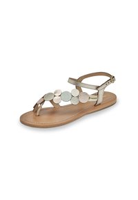 Sandalo in pelle marrone chiaro con design a post per le dita. Presenta accenti metallici circolari in oro, argento e bronzo. Cinturino alla caviglia con fibbia regolabile.