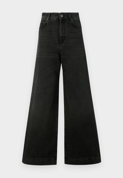 Kõrge vöökohaga, laia säärega teksad tumedast mustast denimist. Omadused hõlmavad kinnitust nuppudega, esi taskuid ja ühtlast tekstuuri vähese pleekimisega.