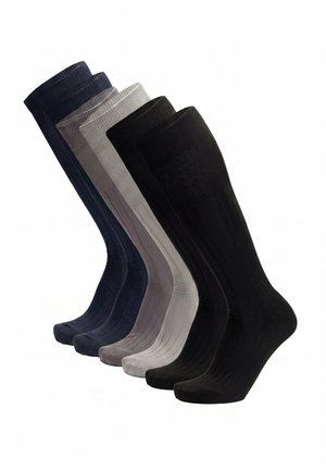 Fünf Paar gerippte knielange Socken in Schwarz, Grau, Hellgrau, Dunkelgrau und Marineblau, nebeneinander angeordnet.