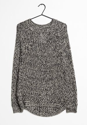 Maglione lavorato a maglia con scollo rotondo, maniche lunghe e un motivo variegato in bianco e nero. Presenta un orlo rilassato e polsini a costine.