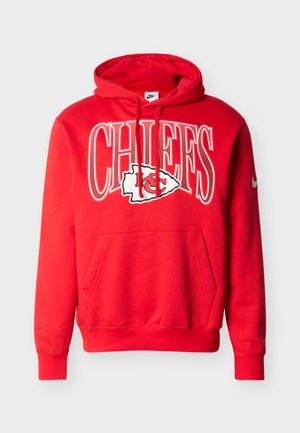 Red hoodie made of cotton blend, features a front pocket, drawstring hood, and bold "CHIEFS" text with emblem. Nike logo on sleeve.