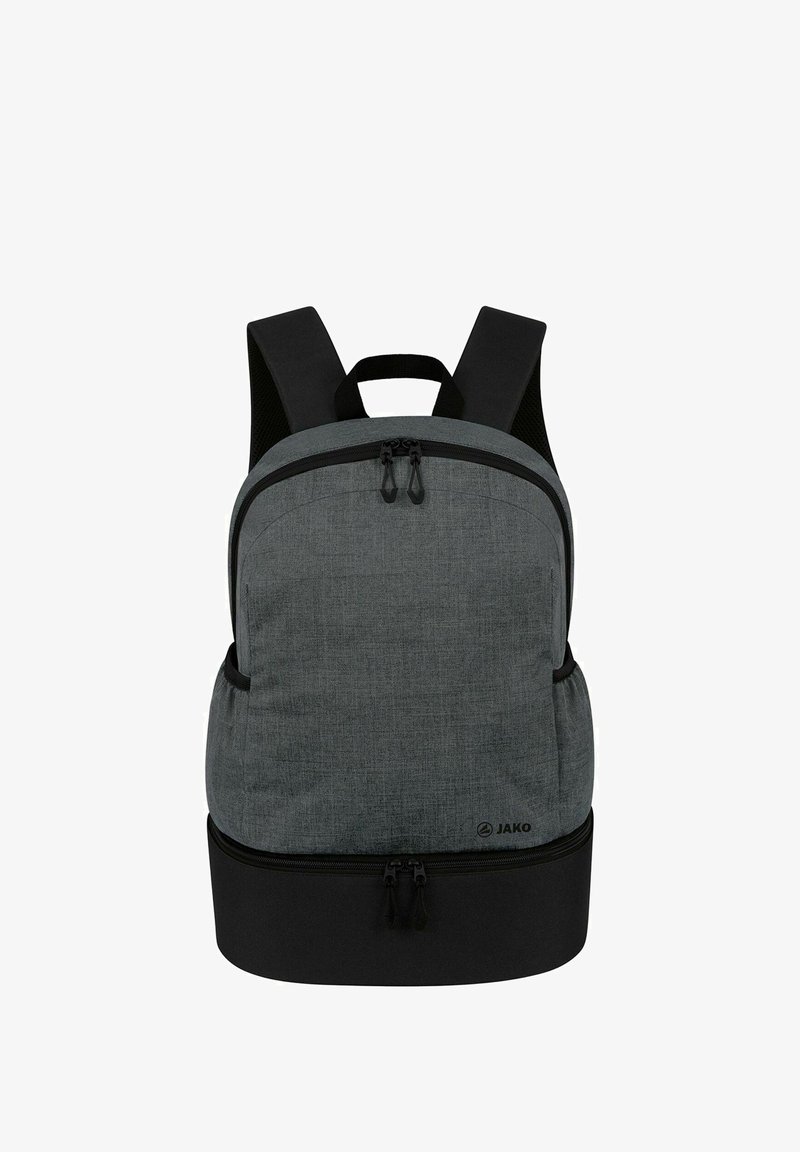 Sac à dos en tissu gris avec un compartiment spacieux, un fond noir, des bretelles ajustables et des tirettes de fermeture à glissière doubles sur le haut arrondi.