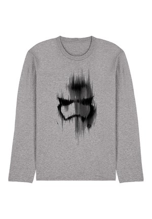 Graues Langarm-T-Shirt mit schwarzem abstraktem Grafikdesign, das eine stilisierte Figur darstellt, mit weicher Stoffstruktur und Rundhalsausschnitt.