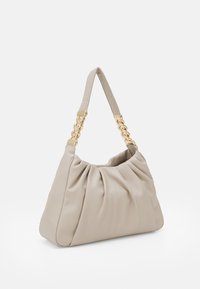 Beige handbag with a pleated design, made of soft material. Features a short strap with gold chain accents. Structured shape, smooth texture.
