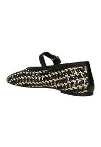 Woven flats with a pointed toe, made of black and beige materials, featuring a strap and a low sole. Textured pattern throughout.