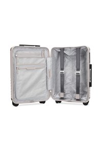 Hartschalenkoffer in Hellbeige mit einem gemusterten grauen Innenraum. Verfügt über mehrere Reißverschlusstaschen und verstellbare Riemen zur Sicherung der Gegenstände.