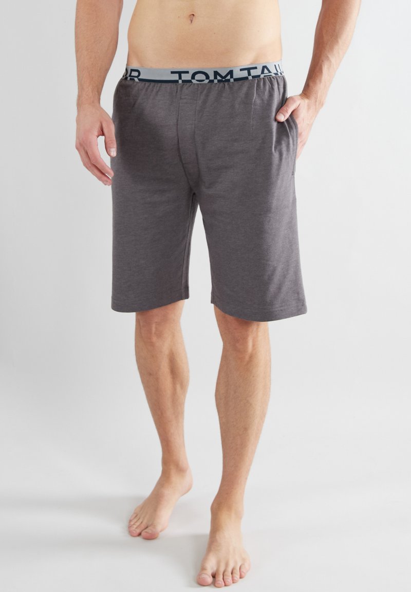 Gray cotton shorts with an elastic waistband featuring "TOM TAILOR" in dark blue lettering, designed for comfort and casual wear.