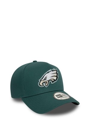 Dark green baseball cap with white and gold eagle logo embroidered on front and adjustable strap visible on back.