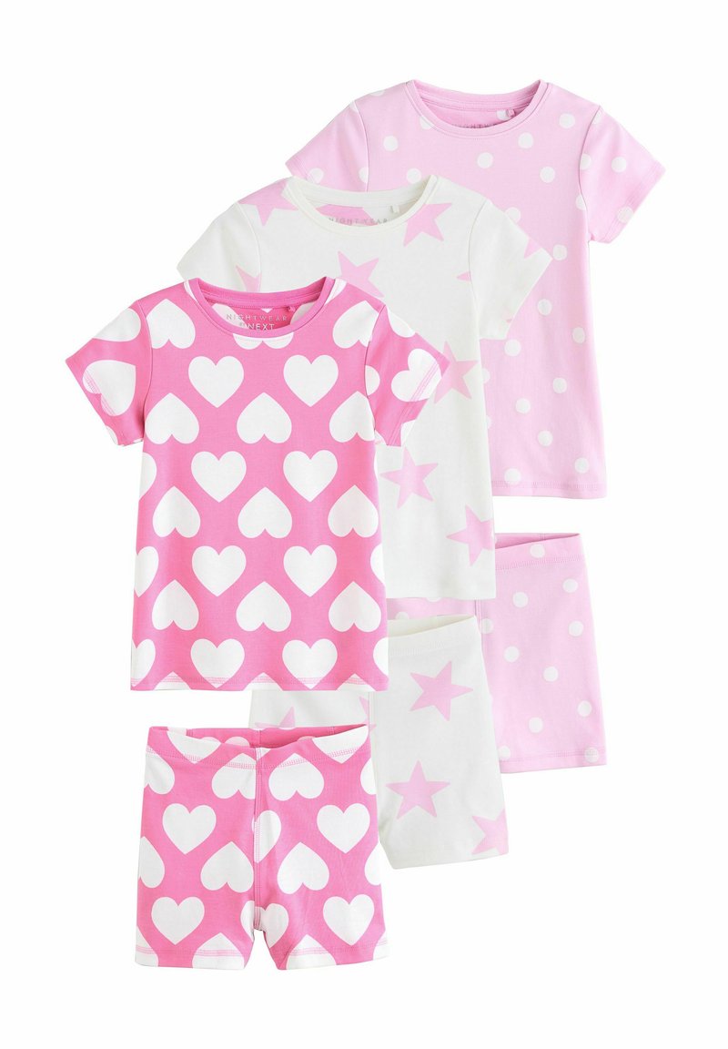 Ensemble de nuit pour enfants composé de cinq pièces, présentant des couleurs rose et blanche avec des motifs de cœurs, d'étoiles et de pois. Fabriqué en coton doux.