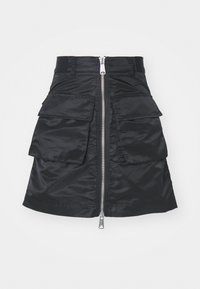 Black skirt made of shiny fabric, featuring a centered zipper and two large front pockets with flaps. Simple, clean design.