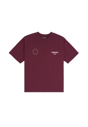 T-shirt oversize bordeaux en coton, avec un motif circulaire étoile et un logo imprimé sur le devant. Manches courtes et coupe décontractée.