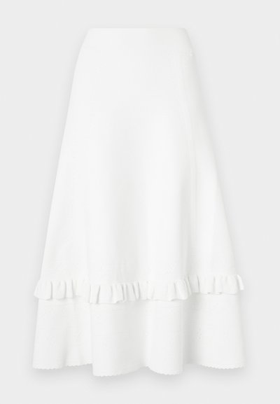 Vit utsvängd kjol i texturerad tyg, med en volangkant och ögondesign, samt en slät midje och knälång klipp.