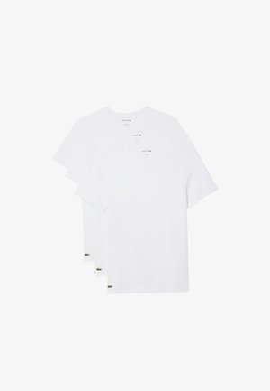 Witte katoenen T-shirts met korte mouwen en ronde halslijnen, met een groen Lacoste-logo op de linksonderhoek. Verpakking van drie.