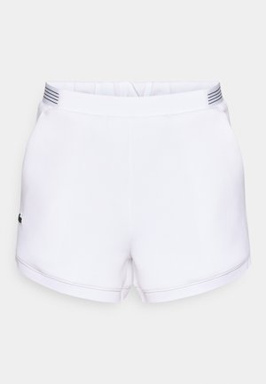 Pantalones cortos blancos hechos de un material liso, con una cintura elástica que presenta un diseño sutil de rayas y un pequeño logo en el lateral.