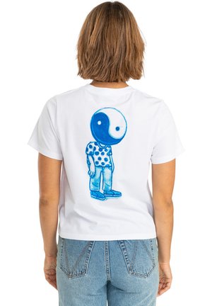 White cotton t-shirt featuring a blue cartoon character with a yin-yang head and polka dot shirt, displayed on the back. Casual fit.